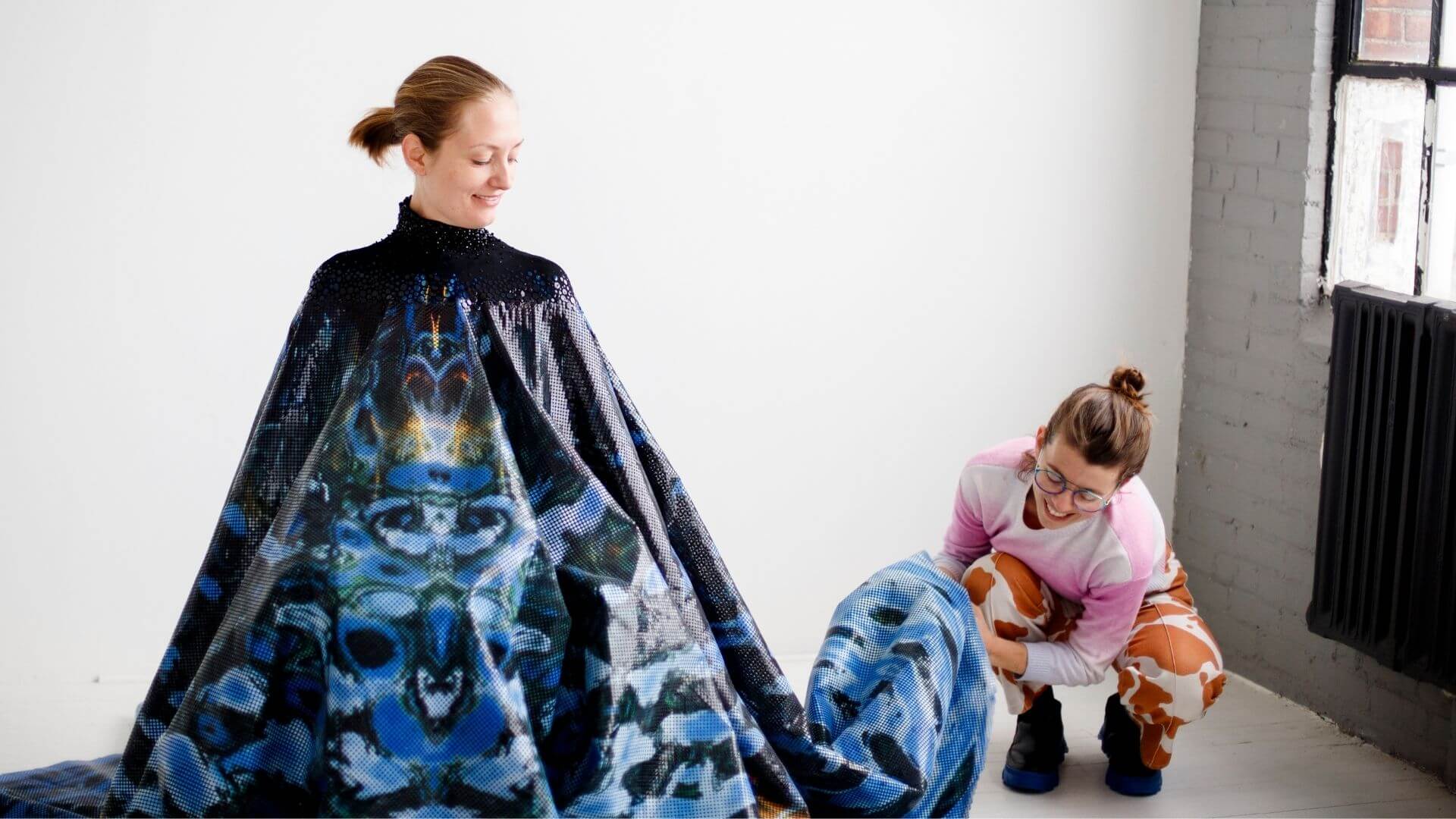 Grace DuVal dressing model in To Love What is Mortal at photoshoot